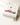 Folded white Team Islam Falisteen sweatshirt with an olive branch in bright daylight — Palestine